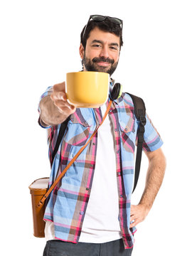 Tourist holding a cup of coffee