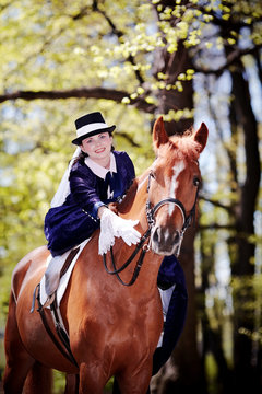 Lady on a red horse.