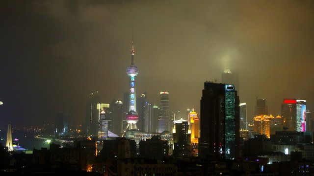 timelapse of a cloudy night time chinese city