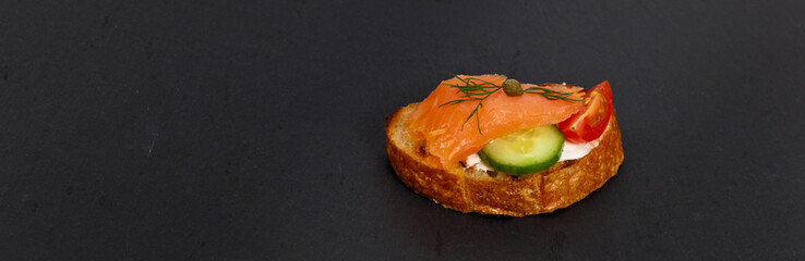Canape with smoked salmon. Selective focus.