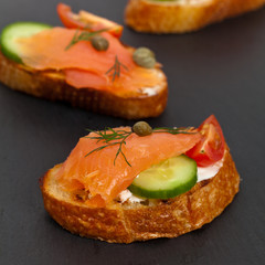Canape with smoked salmon. Selective focus.