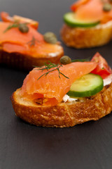 Canape with smoked salmon. Selective focus.