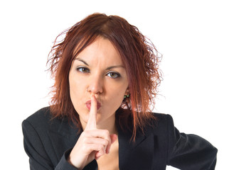 Naklejka premium Redhead girl making silence gesture