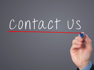 Businessman writing contact us