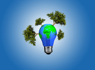 Earth in light bulb on a blue background