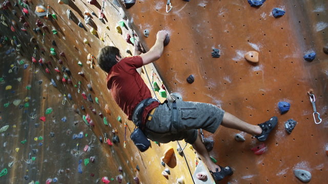 man on an indoor climbing wall