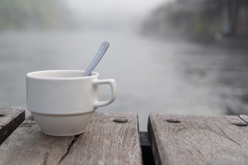 Soft shot of coffee cup and Blurred fog background