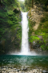 Waterfall in a mountain gorge, Philippines.