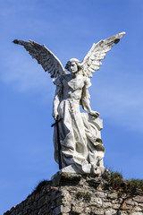 Obraz premium Sculpture of Guardian in the cemetery Comillas
