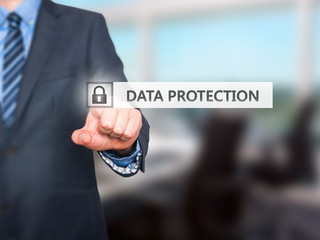 Fototapeta na wymiar Businessman pressing Data Protection button on virtual screen