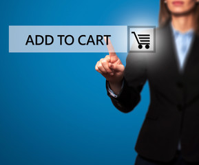 Businesswoman pressing add to cart button on virtual screen