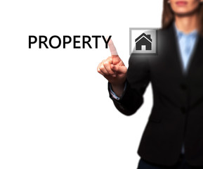 Businesswoman pressing property button on virtual screen
