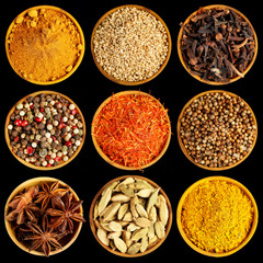Different spices on black background