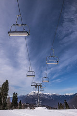 Ski lift chairs in perspective at the sky