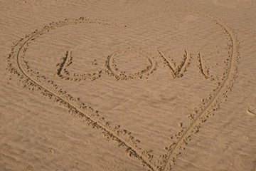Beach background with hearts drawing on summer