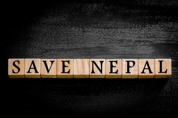 Message SAVE NEPAL isolated on black background