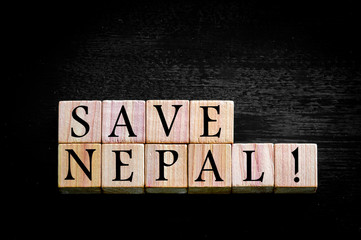 Fototapeta na wymiar Message SAVE NEPAL isolated on black background