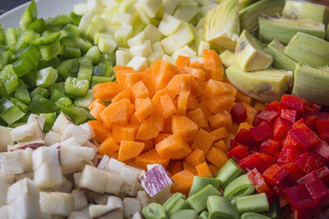Many vegetables cut on dices on a plate