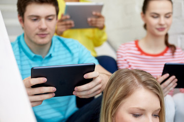 close up of students with tablet pc at school