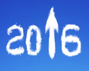 Naklejka na ściany i meble 2016 arrow up sign shape white clouds on blue sky