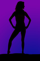 Fototapeta na wymiar silhouette of a woman in a bikini hands on hip knee out