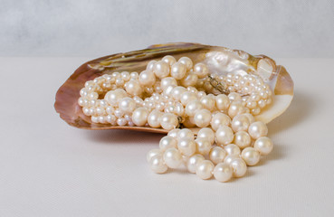Beautiful necklace of white pearls and colored stones in pearl s