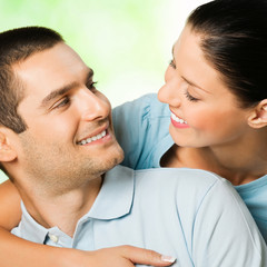 Young couple looking at each other, outdoors