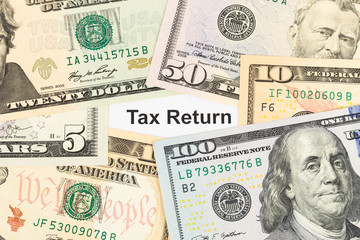 Tax Return and dollar banknote taxation concept