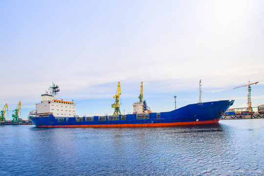  Cargo port. The cargo Ship blue color. Side view.