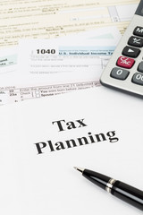 Tax planning wirh calculator taxation concept