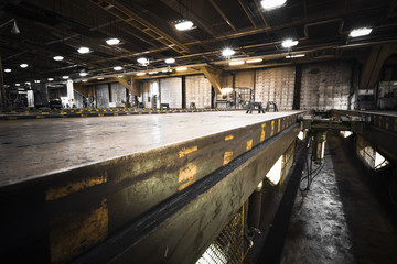 dirty, oily bus garage inspection pit