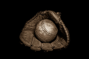 Softball in Glove on Black © Erin Cadigan