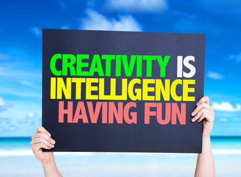 Creativity is Intelligence Having Fun card with beach background