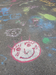 Colored chalks. Colored chalk on playground with drawings on str