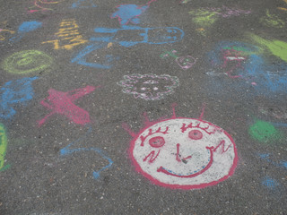 Colored chalks. Colored chalk on playground with drawings on str
