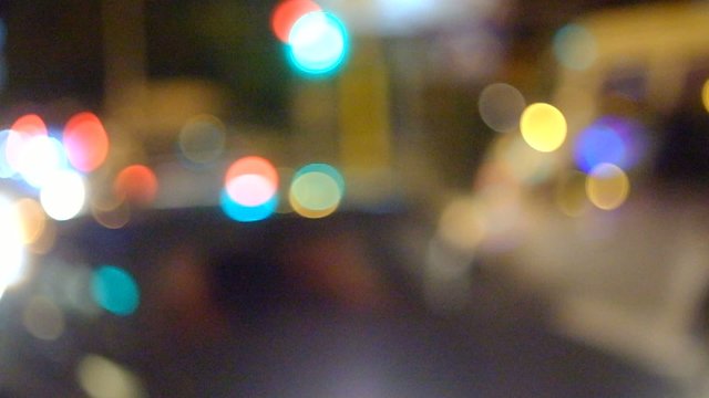 Blurred Defocused Lights of Traffic on a City Road at Night -