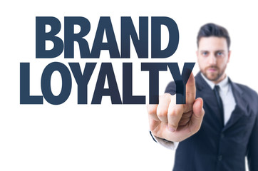 Business man pointing the text: Brand Loyalty