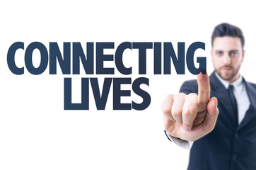 Business man pointing the text: Connecting Lives