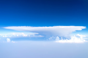 Cloudy blue sky view from aircraft