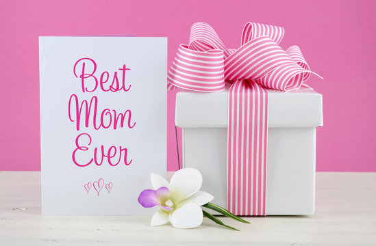 Happy Mothers Day pink and white gift with greeting card.