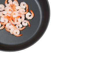 A pan with raw peeled shrimps