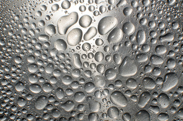 Water drops on metal shiny surface