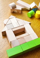 house made of wooden cubes on the table
