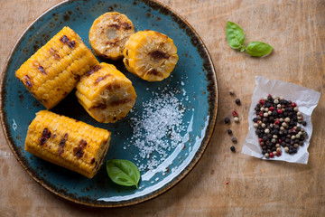 Barbecued corn on the cob, view from above, studio shot