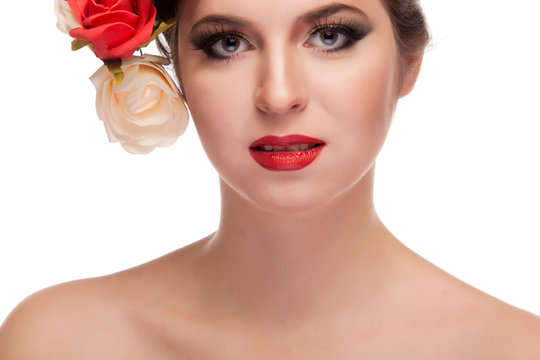 Beauty girl with flowers in head isolated over white background