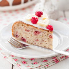 Banana Cake with Sugar Glaze Topped with Raspberries and Banana