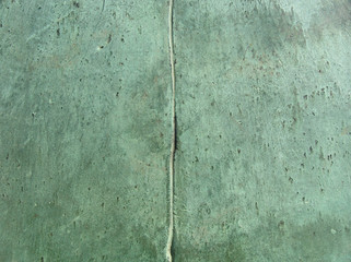 2 bronze panels connected to each other  in green