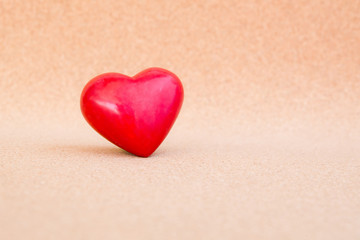 Fototapeta premium red heart on warm wooden background