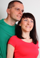 Smiling woman and man looking into distance