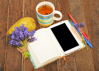 Workplace with notepad, telephone